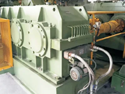 Helical gearboxes for rubber mixing equipment